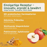 Das Bild zeigt eine einzigartige Rezeptur mit probiotischen Darmbakterien, nützlichen Präbiotika, wohltuenden Magenkräutern und pektinreichem Apfeltrester. Neben den Zutaten sind auch gelbe Gewürze und eine halbe Apfelfrucht sichtbar, die die natürlichen Inhaltsstoffe hervorheben.