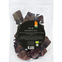 Getrocknete defu Bio-Rinderlungen-Würfel als natürlicher Hundesnack in Bio-Qualität – appetitlich arrangiert in einer Schale auf einem Holzuntergrund, ideal zur Zahnpflege und als artgerechte Belohnung.
