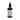 Braune Glasflasche mit Intesto Wohl – einer alkoholfreien Darm-Tinktur für Hunde – inklusive Pipette, umgeben von natürlichen Kräutern wie Eichenrinde, Brombeerblättern, Fenchel und Blutwurz.