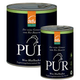 Dose PUR Bio-Hofhuhn Hundefutter aus 100 % Bio-Huhn, ergänzt um Innereien, stehend auf einer Holzoberfläche – hochwertiges Ergänzungsfuttermittel für Hunde mit nur einer Proteinquelle.